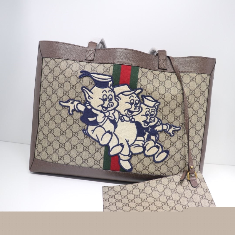 G*u*i shopping bags
